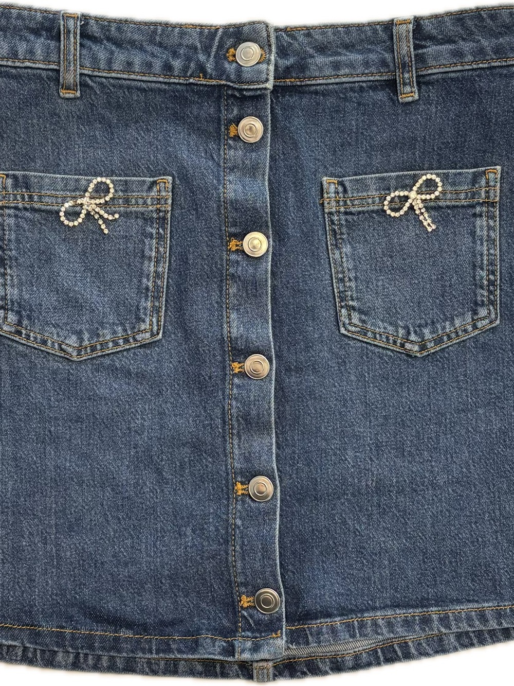Maeve Blue Denim Mini Skirt with Rhinestone Bow Pocket Accents